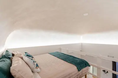 Letto o letti in una camera di Sabbie dell'Etna - Eleganza e Comfort nel Cuore di Catania con Parcheggio Privato