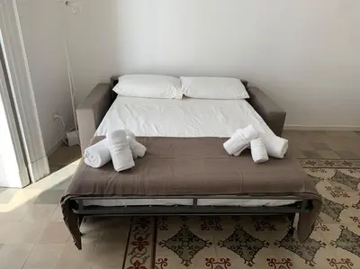 Letto o letti in una camera di The Cement Tiles