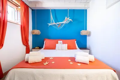 Letto o letti in una camera di La Gorgone Ortigia Apartments