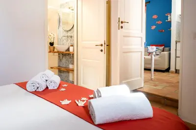 Letto o letti in una camera di La Gorgone Ortigia Apartments