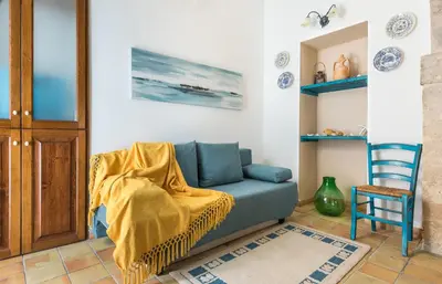 Area soggiorno di La Gorgone Ortigia Apartments