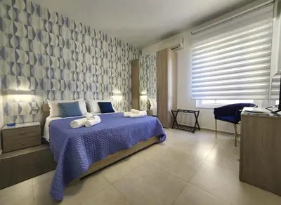 Letto o letti in una camera di MareCalmo Appartamento vista mare Ortigia