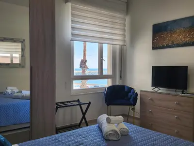 Letto o letti in una camera di MareCalmo Appartamento vista mare Ortigia
