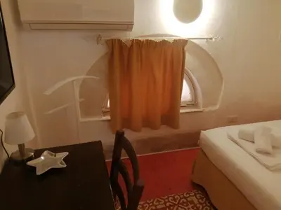 Letto o letti in una camera di Casetta in Ortigia