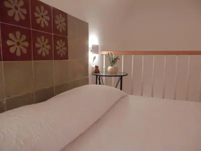 Letto o letti in una camera di Casetta in Ortigia