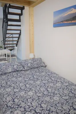 Letto o letti in una camera di La Bella Catania Home