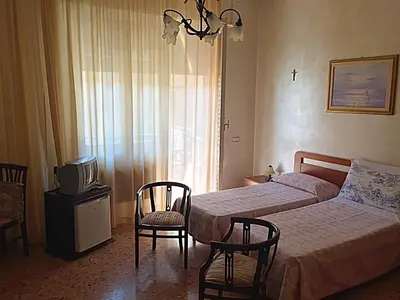 Letto o letti in una camera di B&B Gelone
