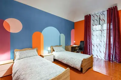 Letto o letti in una camera di GuestHost - I Colori di Lalla - 300 m far from Castello Ursino