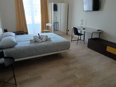 Letto o letti in una camera di Balcone Etnea 2 in Catania centro perfetto per la festa di Sant'Agata