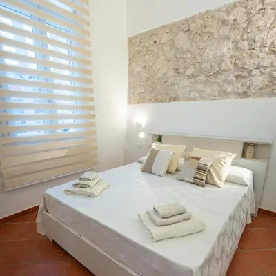 Letto o letti in una camera di Casa ORCHIDEA D'ORO