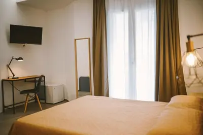 Letto o letti in una camera di Olympus