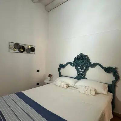 Letto o letti in una camera di A MARE AMARE - rifugio nel cuore di Ortigia