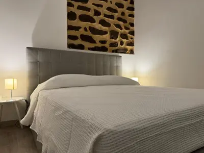 Letto o letti in una camera di Casa Terme della Rotonda