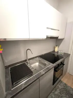 Cucina o angolo cottura di BiBiHome Catania appartamento in centro storico