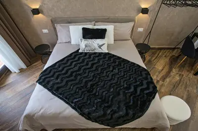 Letto o letti in una camera di Lustru Apartment