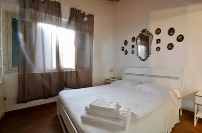 Letto o letti in una camera di Elorina Casa Vacanze Birri sul mare Vendicari Noto