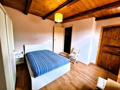 Letto o letti in una camera di Villa del Mandorlo