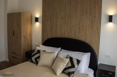 Letto o letti in una camera di Casa Vacanza LE PORTE DI AGATA , Viale San Teodoro Catania