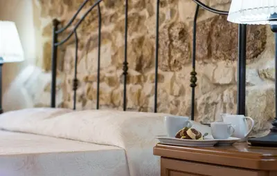 Letto o letti in una camera di Relais Case Passamonte Resort & Rooms