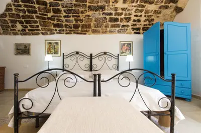 Letto o letti in una camera di Relais Case Passamonte Resort & Rooms