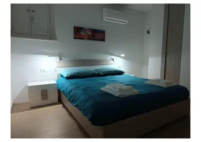 Letto o letti in una camera di Casa Angelino