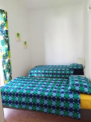 Letto o letti in una camera di Casa Orchidea Sortino