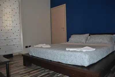 Letto o letti in una camera di La Terrazza dell’ODEON