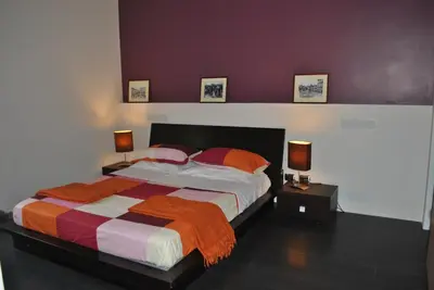 Letto o letti in una camera di La Terrazza dell’ODEON