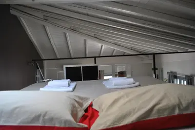 Letto o letti in una camera di La Terrazza dell’ODEON