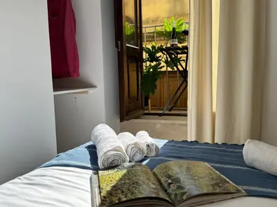 Letto o letti in una camera di Casa Artemis nel cuore di Ortigia a Siracusa
