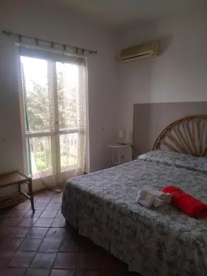Letto o letti in una camera di Casa Rosa Isola