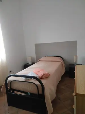 Letto o letti in una camera di Casa Rosa Isola