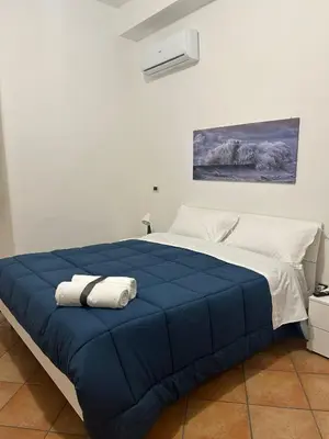 Letto o letti in una camera di Archi di Mare Apartments