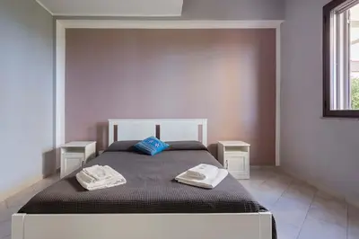 Letto o letti in una camera di Villa con piscina vista mare e Etna