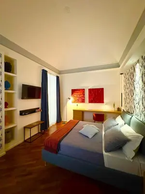 Letto o letti in una camera di Duomo Leonardo31 Dimora di Charme