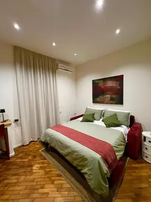 Letto o letti in una camera di Duomo Leonardo31 Dimora di Charme