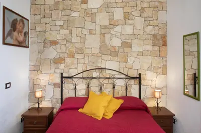 Letto o letti in una camera di BeB Nonno Baffo