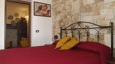 Letto o letti in una camera di BeB Nonno Baffo