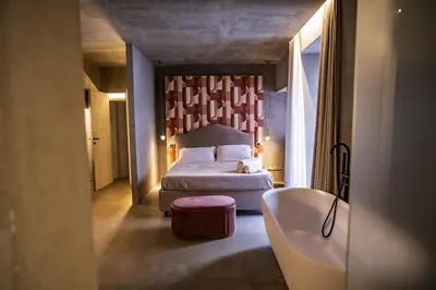 Letto o letti in una camera di CHARME Catania Central Suites