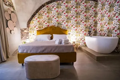 Letto o letti in una camera di CHARME Catania Central Suites