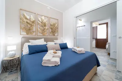 Letto o letti in una camera di Regina Damarete Ortigia Boutique Apartment