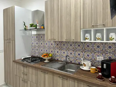 Cucina o angolo cottura di Nonno 'nzinu 150 meters from the sandy beach with wifi