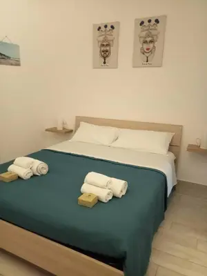 Letto o letti in una camera di F&M RELAX ROOM NOTO MARINA