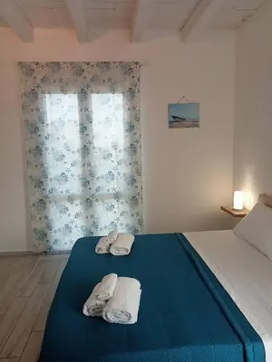 Letto o letti in una camera di F&M RELAX ROOM NOTO MARINA