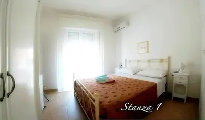 Letto o letti in una camera di Casa Tramonto sull' Isola
