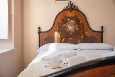 Letto o letti in una camera di Residenza Mistral Ortigia a 2 passi dal mare