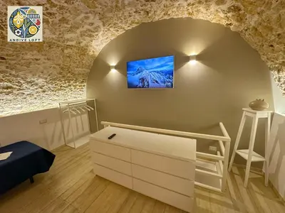 Letto o letti in una camera di Andive Loft