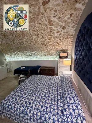 Letto o letti in una camera di Andive Loft