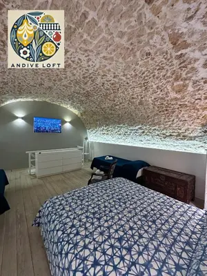 Letto o letti in una camera di Andive Loft