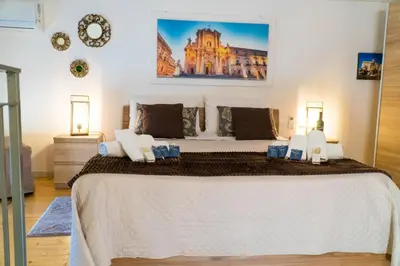 Letto o letti in una camera di Casa Marilu’